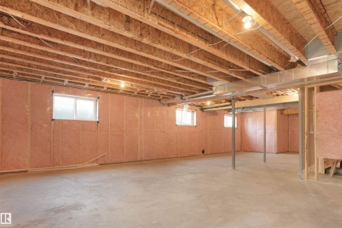 Unfinished basement featuring exposed joists, concrete flooring, and insulated framed walls - 22139 81 Avenue, Edmonton, AB - Indoor Photo Showing Basement