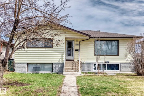 Ranch-style residence featuring horizontal siding and a gabled roof - 12825 102 Street, Edmonton, AB - Outdoor