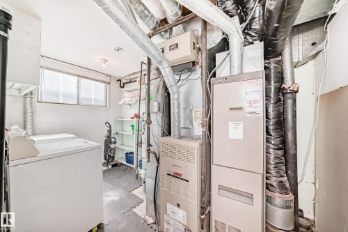 Dedicated utility room with two horizontal windows - 12825 102 Street, Edmonton, AB - Indoor
