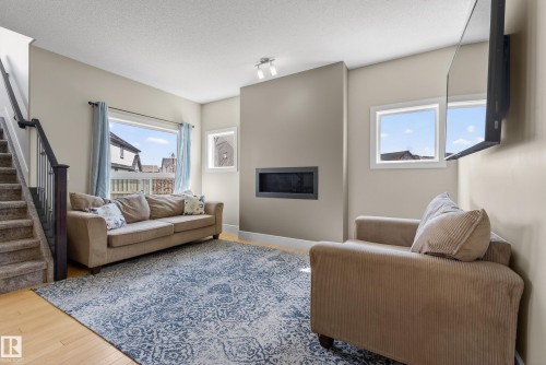 3633 Atkinson Loop, Edmonton, AB - Indoor Photo Showing Living Room With Fireplace