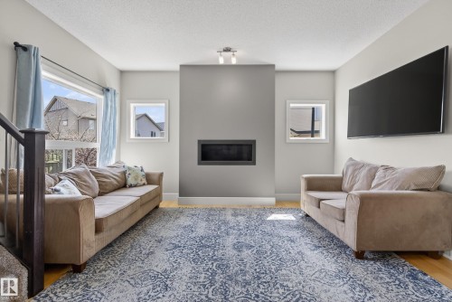 3633 Atkinson Loop, Edmonton, AB - Indoor Photo Showing Living Room With Fireplace