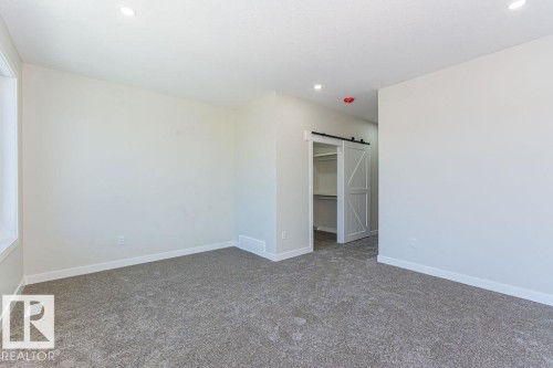 Spacious room featuring gray carpet, white baseboards, and neutral wall paint - 9814 155 Street, Edmonton, AB - Indoor Photo Showing Other Room