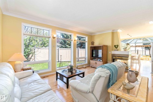 8 Butterworth Point(E), Edmonton, AB - Indoor Photo Showing Living Room With Fireplace