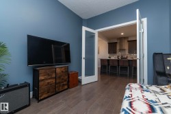 Interior space with wood-finish flooring and blue walls - 