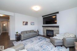 Living area featuring wood-finish flooring and light-toned walls - 