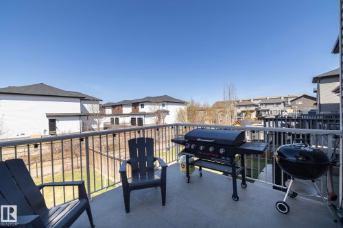 Outdoor balcony featuring a textured concrete surface and sturdy metal railings - 2016 Redtail Common, Edmonton, AB - Outdoor With Exterior