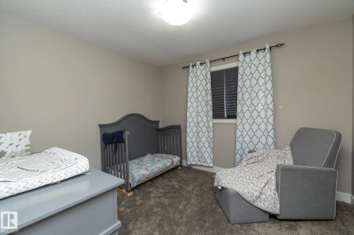 Neutral-toned wall paint with textured carpeting - 2016 Redtail Common, Edmonton, AB - Indoor Photo Showing Bedroom
