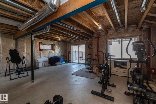 Unfinished basement offering expansive open space, exposed ceiling joists, and concrete flooring - 2016 Redtail Common, Edmonton, AB - Indoor Photo Showing Basement