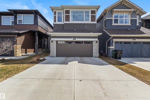 Contemporary exterior featuring stone accents and horizontal siding - 1471 Plum Circle Circle, Edmonton, AB - Outdoor With Facade