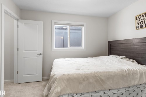 Neutral-toned walls complement light-colored carpeting - 1471 Plum Circle Circle, Edmonton, AB - Indoor Photo Showing Bedroom