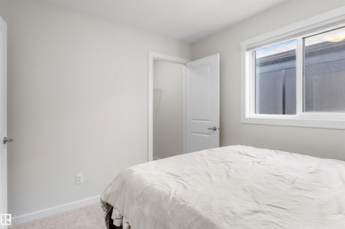 Room featuring light gray wall paint, white trim, and neutral carpet flooring - 1471 Plum Circle Circle, Edmonton, AB - Indoor Photo Showing Bedroom