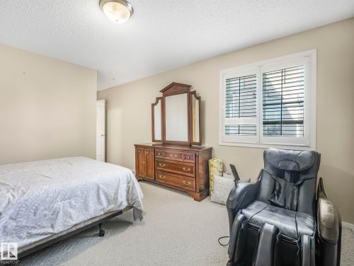 Bedroom with neutral wall color and light-colored carpeting - 317 2420 108 Street, Edmonton, AB - Indoor Photo Showing Bedroom