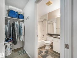 Built-in closet shelving and hanging rod with wood-finish flooring - 