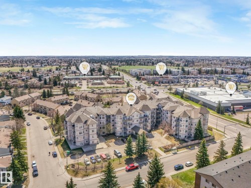 Multi-story building featuring light-toned siding and multiple balconies - 317 2420 108 Street, Edmonton, AB - Outdoor With View