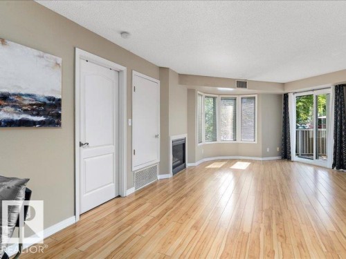 204 9640 105 Street, Edmonton, AB - Indoor Photo Showing Other Room With Fireplace