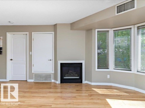 204 9640 105 Street, Edmonton, AB - Indoor Photo Showing Other Room With Fireplace