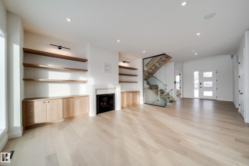 5605 Cautley Cove, Edmonton, AB - Indoor Photo Showing Living Room With Fireplace