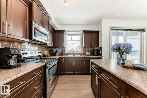 308 1623 James Mowatt Trail, Edmonton, AB - Indoor Photo Showing Kitchen With Double Sink