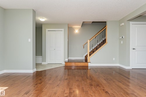 Hardwood flooring throughout the main level - 8530 76 Avenue, Edmonton, AB - Indoor Photo Showing Other Room