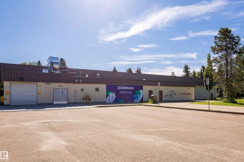 Commercial building with a light-colored facade and a dark brown roofline - 8530 76 Avenue, Edmonton, AB - Outdoor