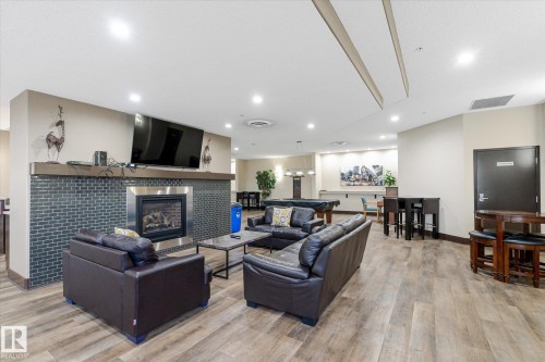 410 7909 71 Street, Edmonton, AB - Indoor Photo Showing Living Room With Fireplace
