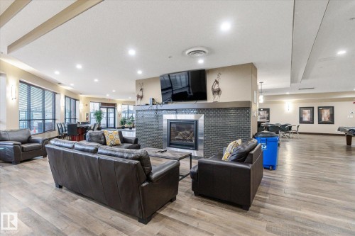 410 7909 71 Street, Edmonton, AB - Indoor Photo Showing Living Room With Fireplace