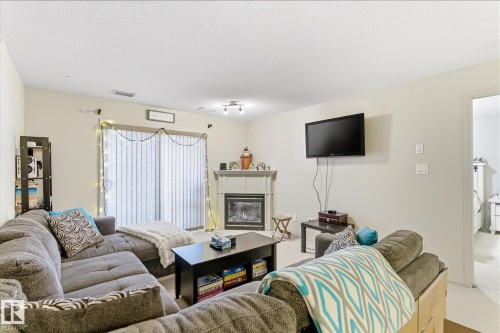 410 7909 71 Street, Edmonton, AB - Indoor Photo Showing Living Room With Fireplace