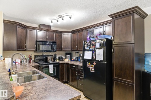 410 7909 71 Street, Edmonton, AB - Indoor Photo Showing Kitchen With Double Sink