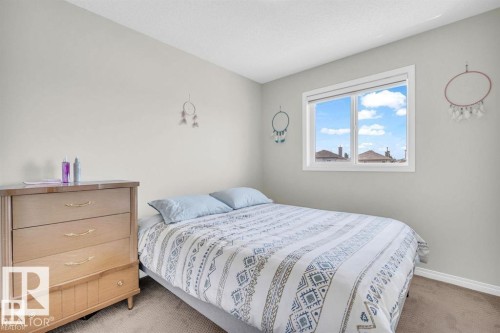 Carpeted room featuring a single window with white trim, light-toned walls, and white baseboards - 21223 92 Avenue, Edmonton, AB - Indoor Photo Showing Bedroom