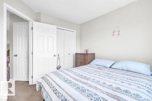Bedroom featuring light-toned walls and carpet flooring - 21223 92 Avenue, Edmonton, AB - Indoor Photo Showing Bedroom