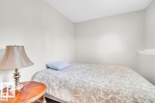 Light-toned painted walls enhance the room's brightness - 21223 92 Avenue, Edmonton, AB - Indoor Photo Showing Bedroom