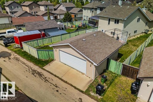 Detached rear garage with a shingled roof and vinyl siding - 21223 92 Avenue, Edmonton, AB - Outdoor
