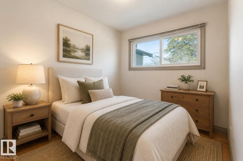 Bedroom featuring light-colored walls and wood-finish flooring - 10620 68 Avenue, Edmonton, AB - Indoor Photo Showing Bedroom