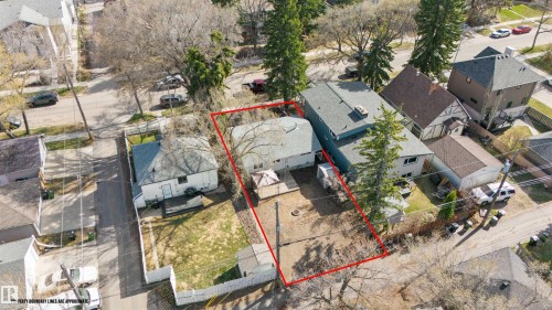 Aerial view of a residential property outlined in red, featuring a rear yard with a gazebo and mature trees - 10620 68 Avenue, Edmonton, AB - Outdoor