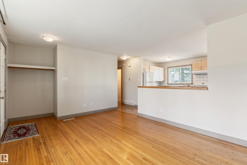 Open concept living area featuring hardwood flooring - 10620 68 Avenue, Edmonton, AB - Indoor