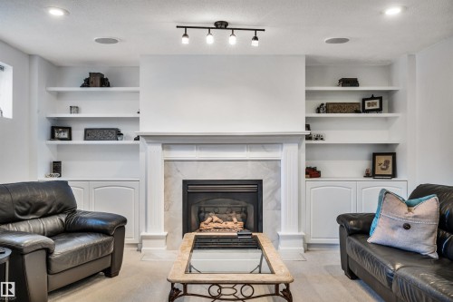 9008 169A Avenue, Edmonton, AB - Indoor Photo Showing Living Room With Fireplace