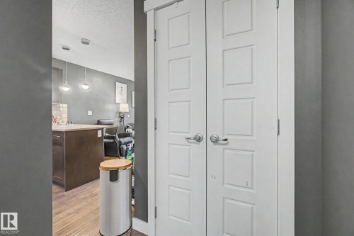 White paneled bifold doors with brushed nickel hardware - 210 401 Southfork Drive, Leduc, AB - Indoor Photo Showing Other Room