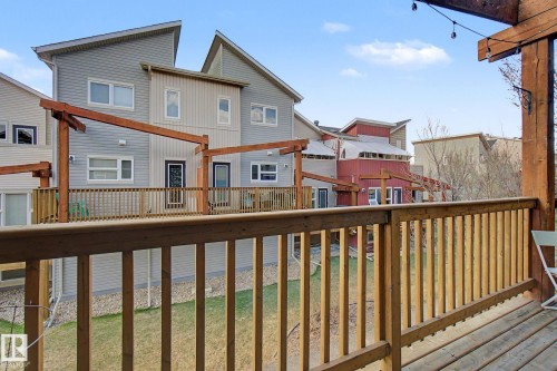 Wood deck with railings and string lights - 210 401 Southfork Drive, Leduc, AB - Outdoor With Balcony With Exterior