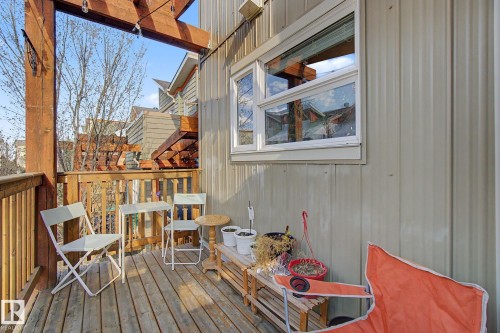 Expansive wood-decked balcony featuring a wood pergola and durable siding - 210 401 Southfork Drive, Leduc, AB - Outdoor With Deck Patio Veranda With Exterior