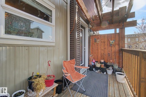 Private outdoor deck featuring wood flooring and a privacy wall - 210 401 Southfork Drive, Leduc, AB - Outdoor With Exterior