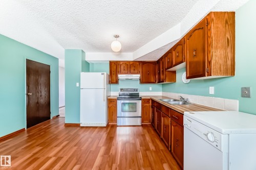 13862 24 Street, Edmonton, AB - Indoor Photo Showing Kitchen With Double Sink