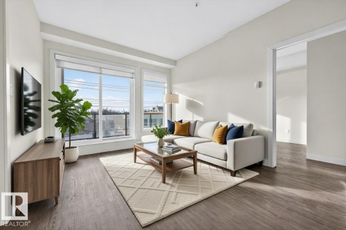 304 10837 83 Avenue, Edmonton, AB - Indoor Photo Showing Living Room