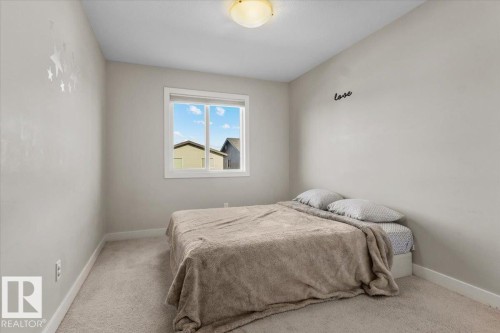 Carpeted room featuring light gray walls, a single window with white trim, and a flush mount ceiling light - 2847 Koshal Crescent, Edmonton, AB - Indoor Photo Showing Bedroom