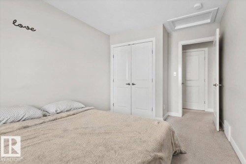 Neutral-toned room featuring a soft carpeted floor and light gray walls - 2847 Koshal Crescent, Edmonton, AB - Indoor Photo Showing Bedroom