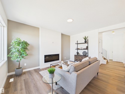 407 Brickyard Point(E), Stony Plain, AB - Indoor Photo Showing Living Room With Fireplace