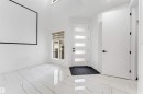 Bright entry foyer featuring high ceilings and white walls - 1827 17 Avenue, Edmonton, AB  - Indoor Photo Showing Other Room 