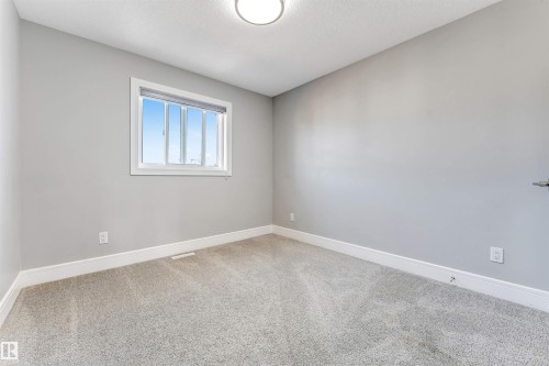 Bright room with light gray walls and plush gray carpet - 1103 29 Street, Edmonton, AB - Indoor Photo Showing Other Room