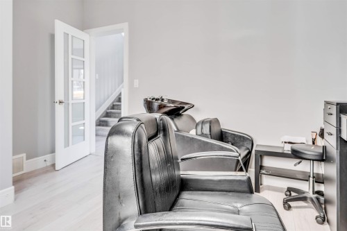 Light wood-finish flooring complements the neutral wall color - 1103 29 Street, Edmonton, AB - Indoor