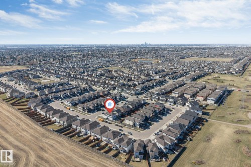 Expansive residential development featuring numerous single-family homes with dark roofs and light-colored siding - 1103 29 Street, Edmonton, AB - Outdoor With View