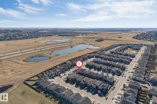 Aerial view of a residential community featuring a network of streets and numerous detached and attached homes - 1103 29 Street, Edmonton, AB - Outdoor With View
